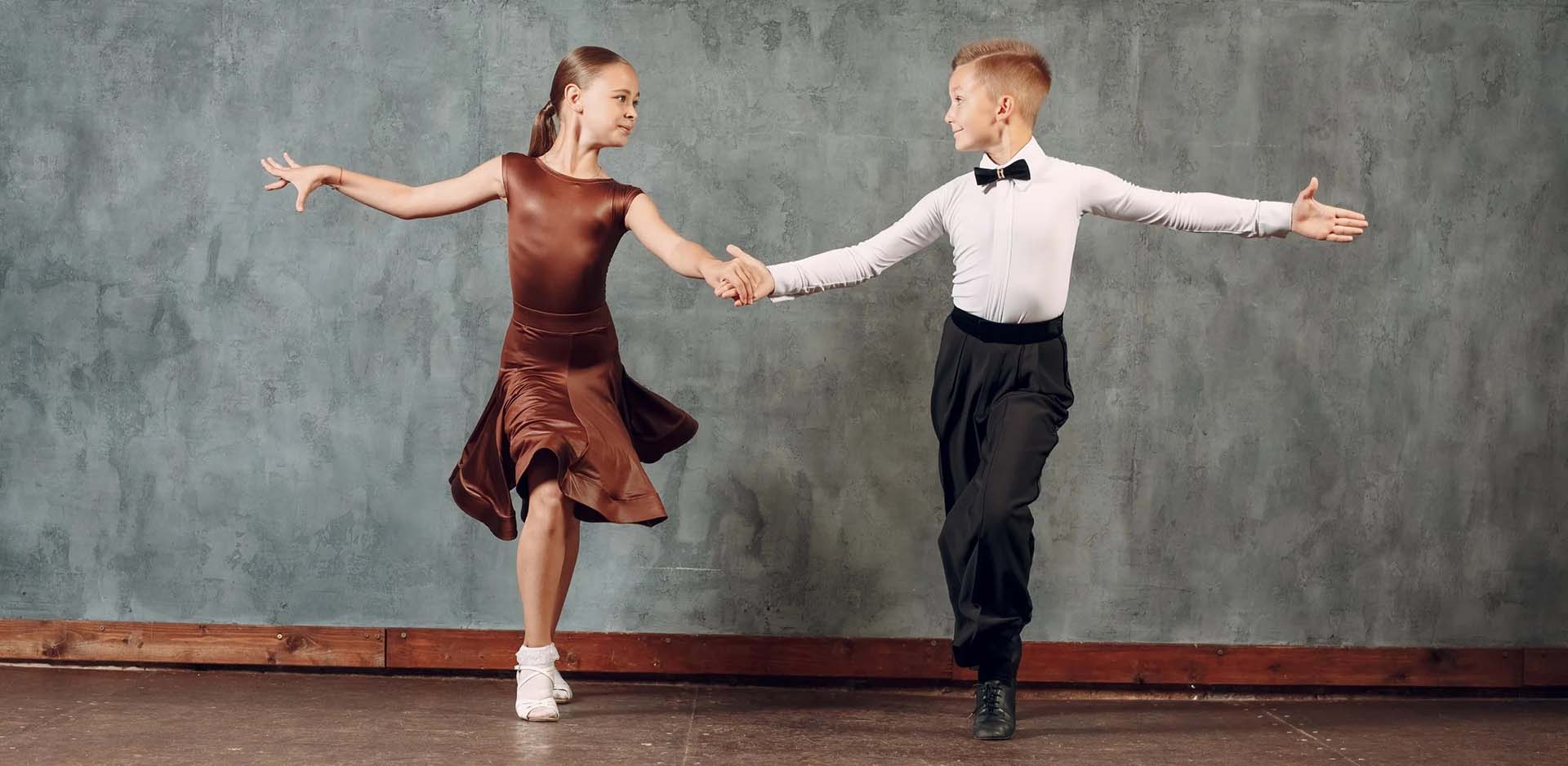 Young dancers boy and girl dancing in ballroom dance Samba