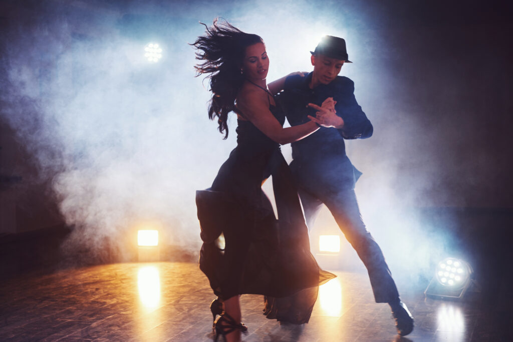 Skillful,Dancers,Performing,In,The,Dark,Room,Under,The,Concert