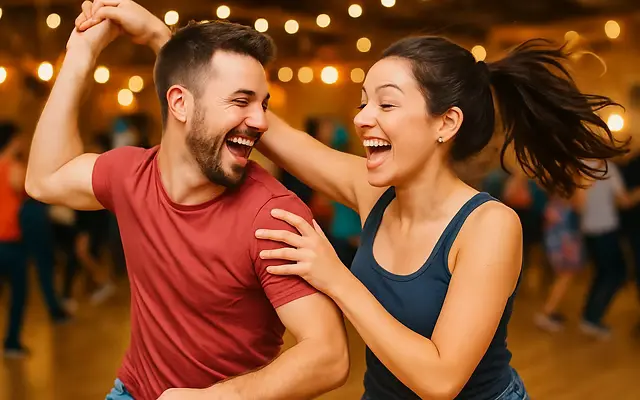 Group ballroom dance class in The Woodlands TX with couples in their 40s partner dancing and socializing