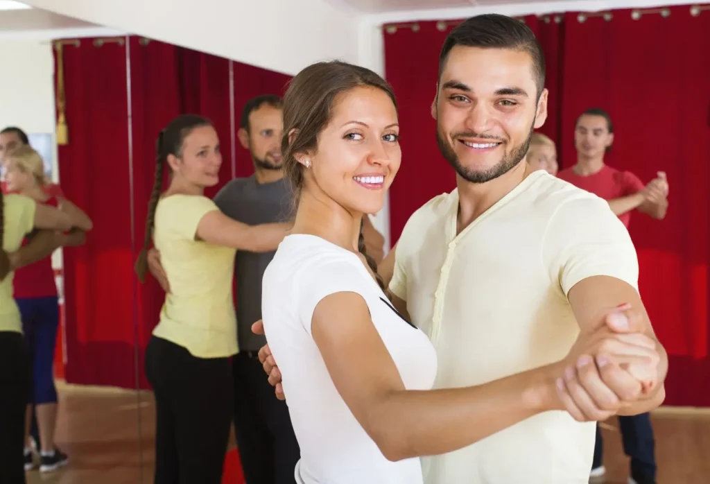 Couple enjoying ballroom dance lessons in The Woodlands TX for adults in their 40s
