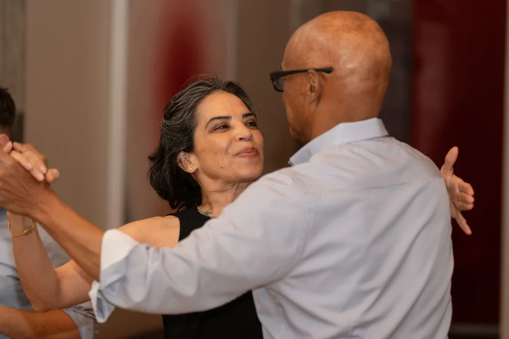Adult couple ballroom dancing together during a dance lesson in The Woodlands Texas