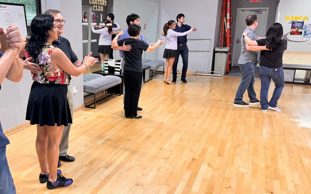 Adults meeting new people through ballroom dance lessons in The Woodlands TX